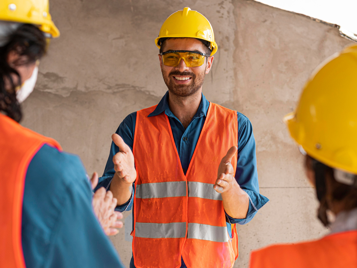 Workers in protective suits with toxic waste